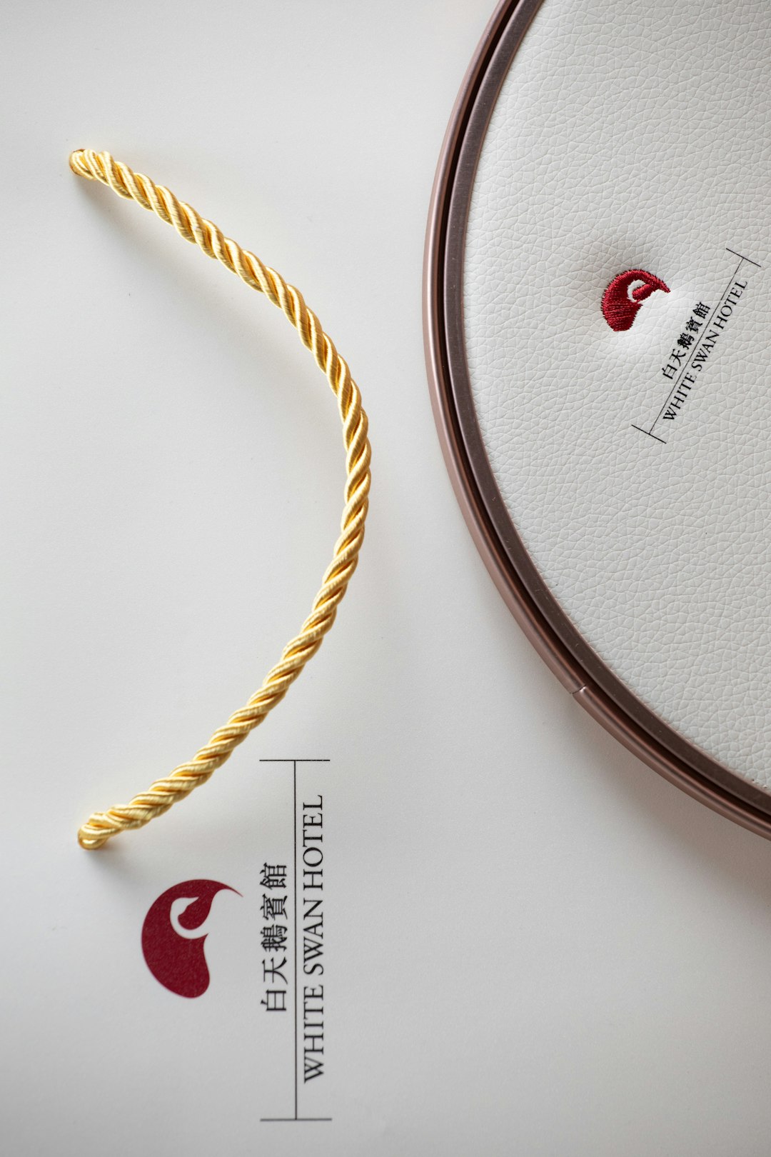 gold-rope-and-white-swan-hotel-logo-velijvlzy1w